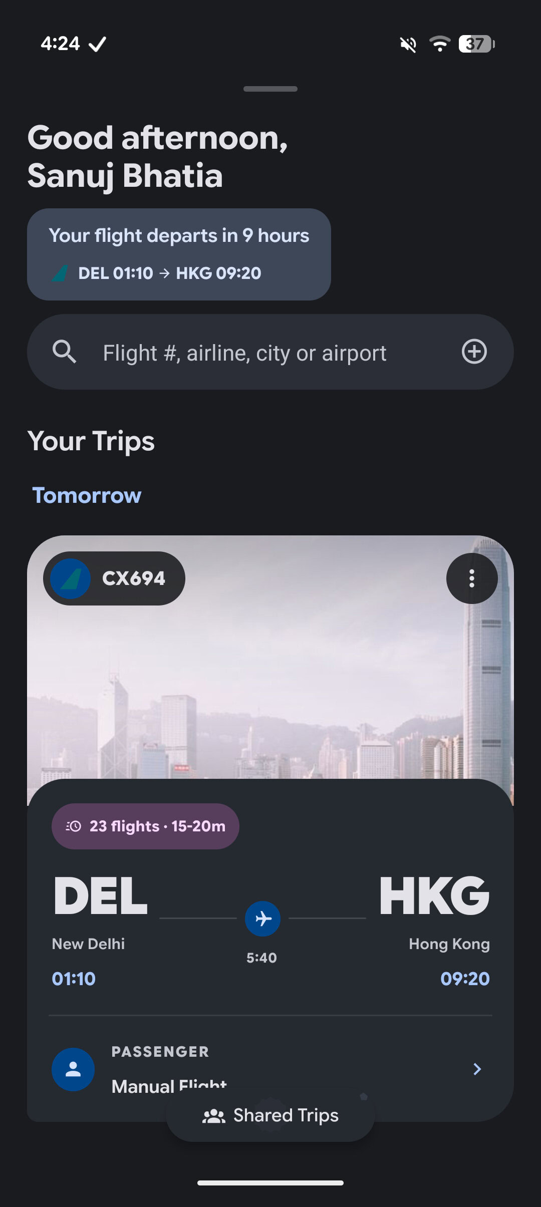 Home screen greeting with upcoming flight and trip card shown