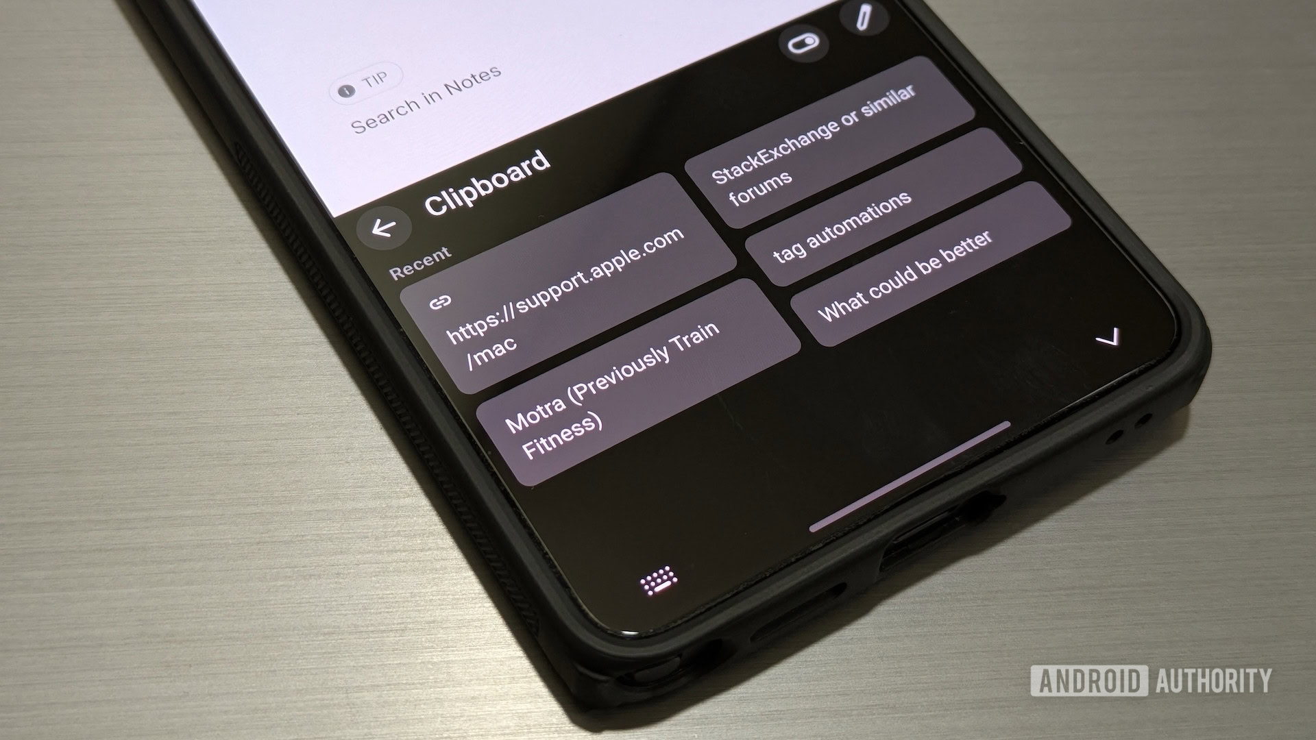 Accessing Gboard's clipboard history on a Samsung phone.