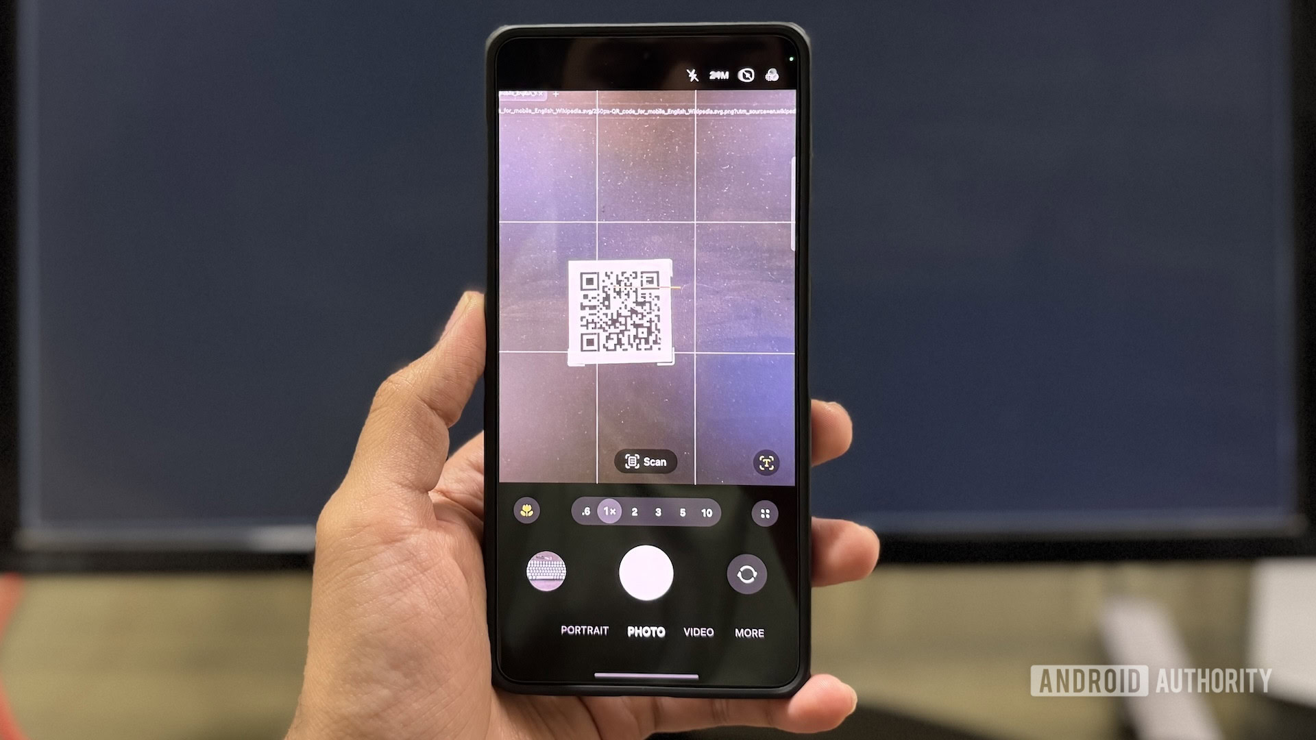 Scanning a QR code using Samsung's Camera app.