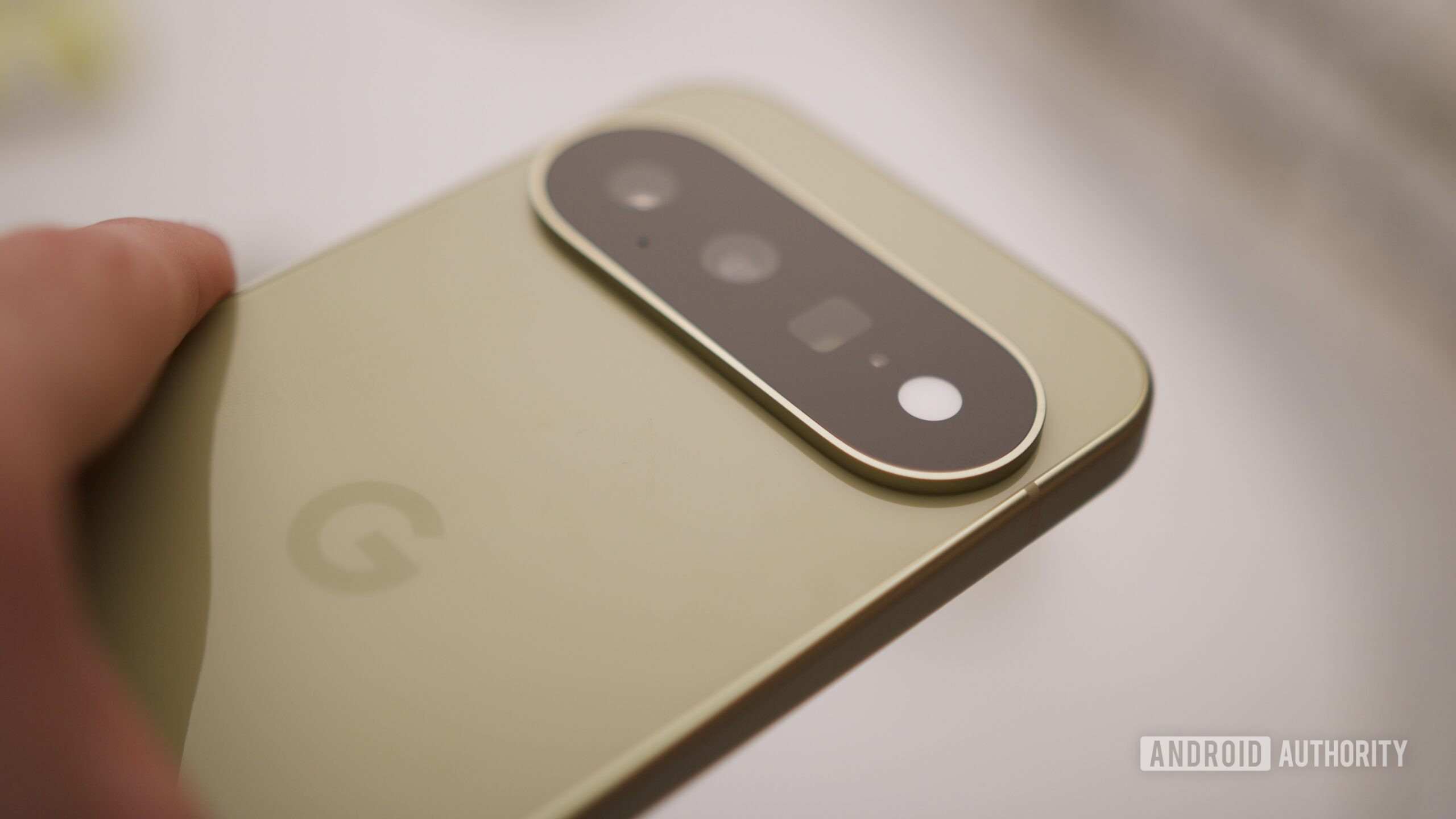 Close up of the camera bar on the Google Pixel 11 in Pistachio.