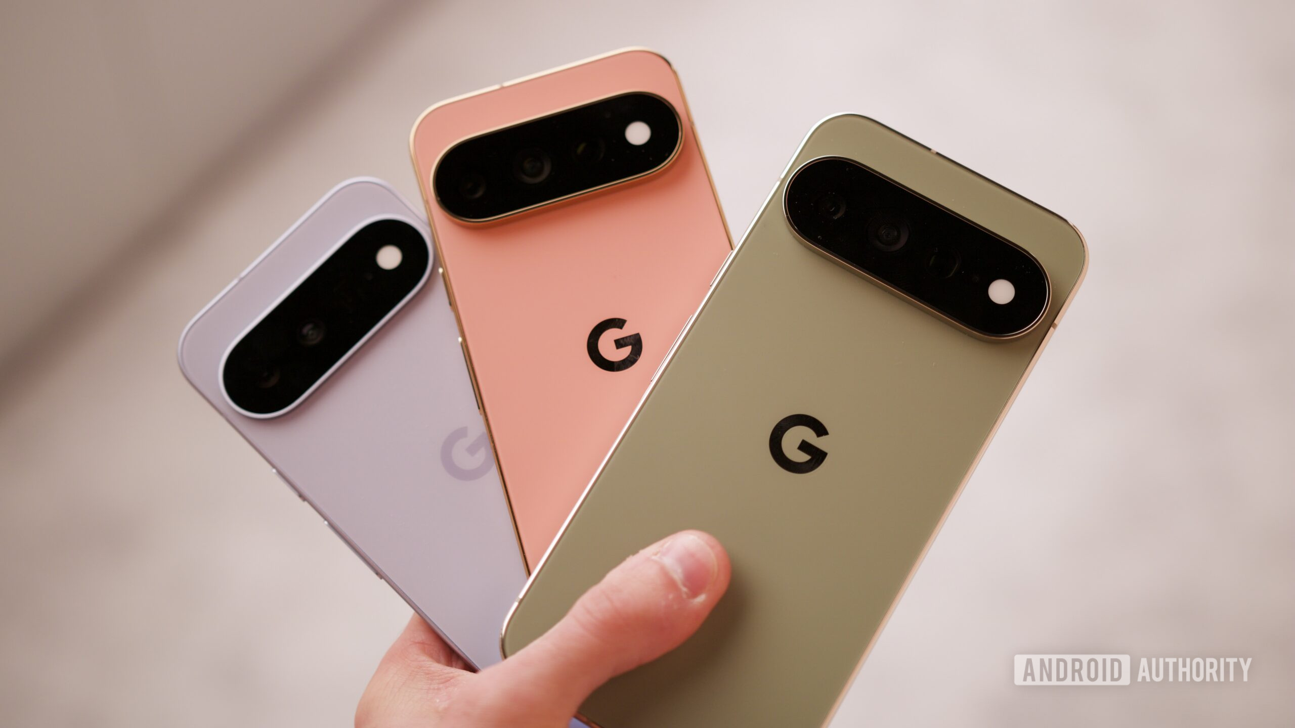google pixel 11 pixel 11 pro pixel 11 pro xl hands on 3 Someone holding the Google Pixel 11, Pixel 11 Pro, and Pixel 11 Pro XL.