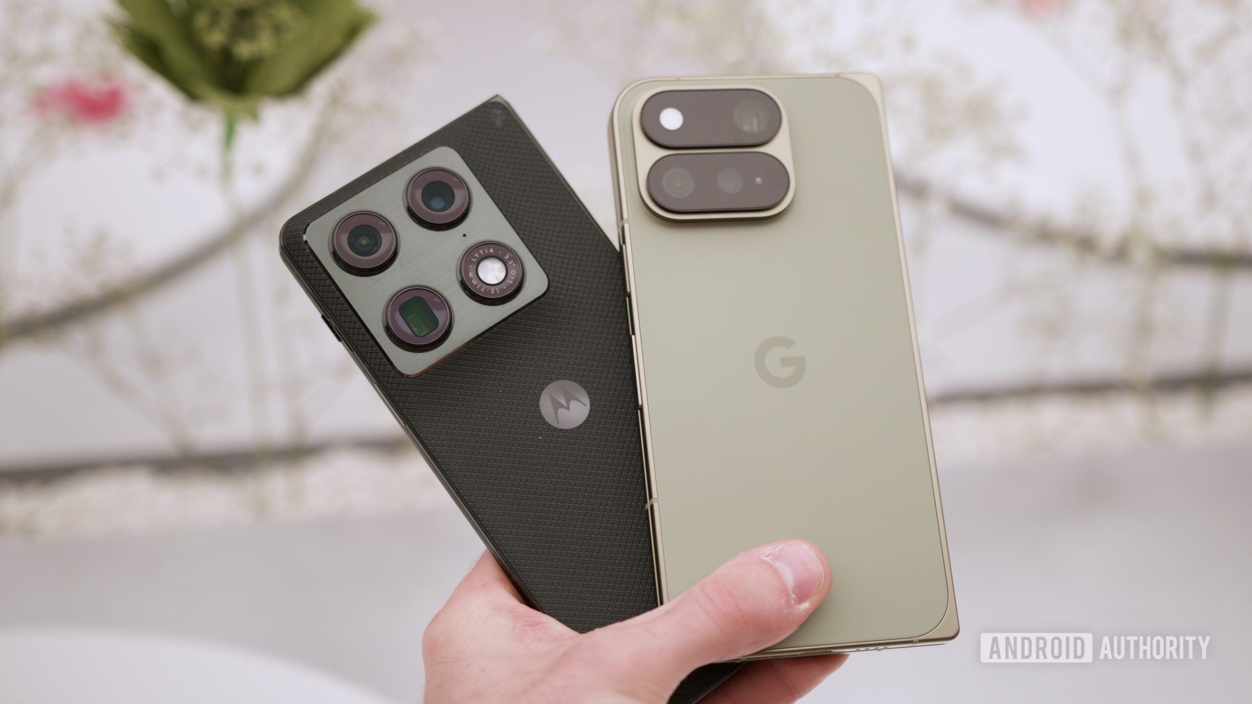 google pixel 11 pro fold vs motorola razr fold hands on 1 Someone holding the Motorola Razr Fold and Google Pixel 11 Pro Fold.