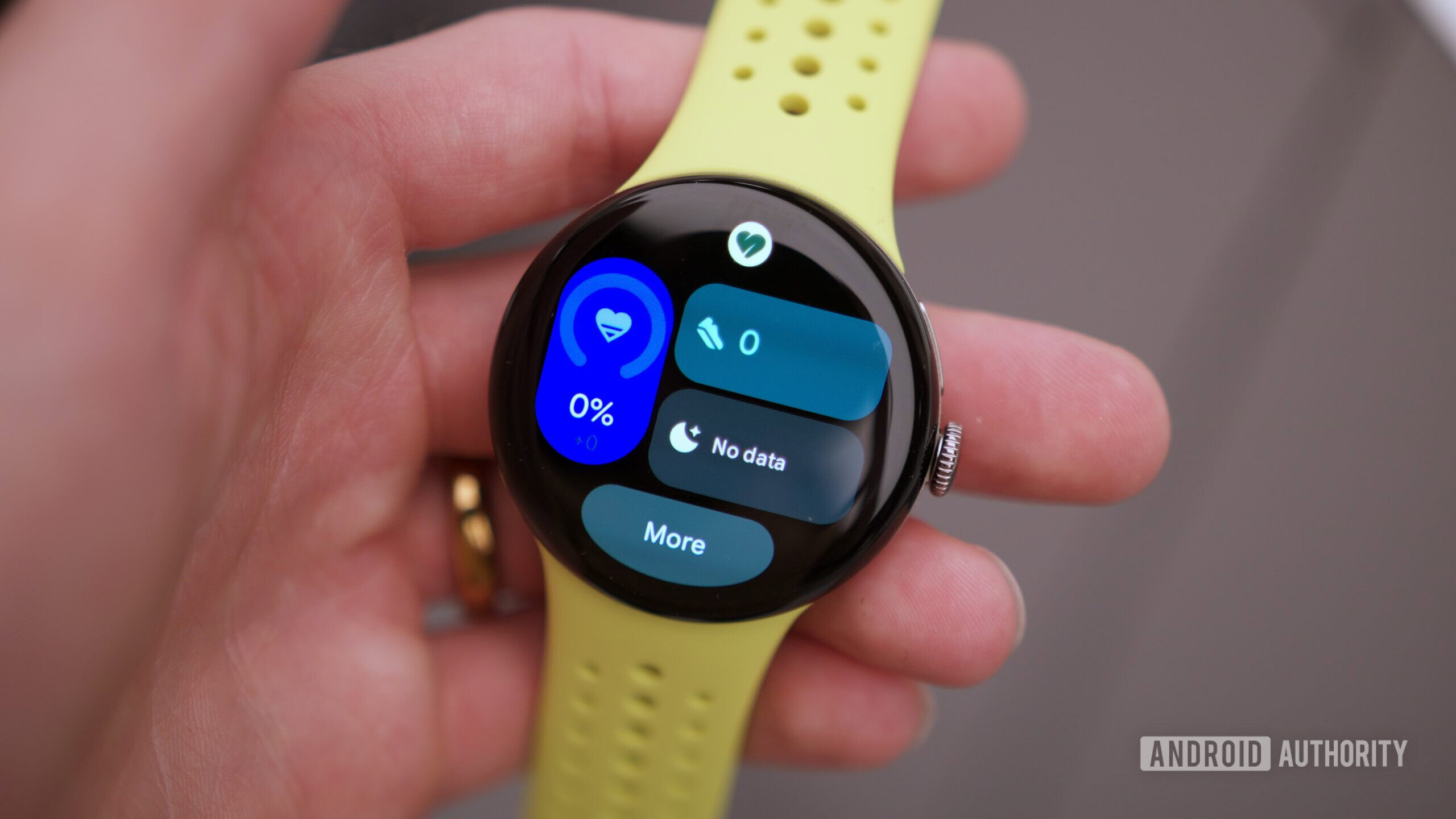 google pixel watch 5 hands on 2 Google Pixel Watch 5 with the screen on, showing workout widgets.