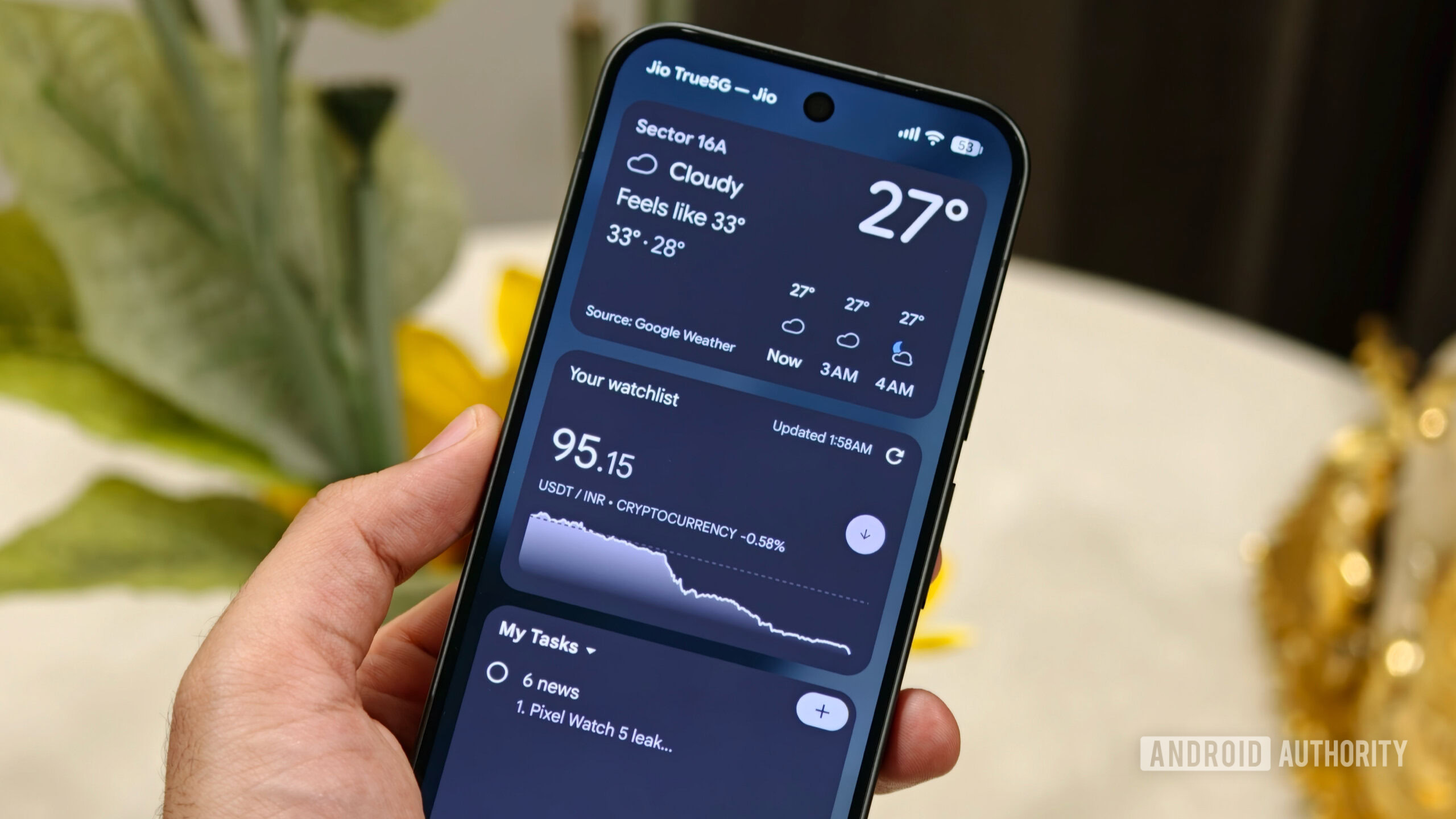 Pixel 11 lock screen showing weather, stock, and task widgets