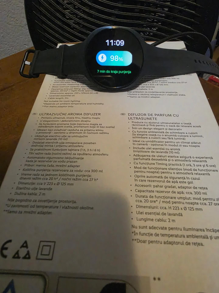 Samsung Galaxy Watch 9 screen displaying 98 percent battery charge at 11:09 AM using a fan to prevent thermal throttling.