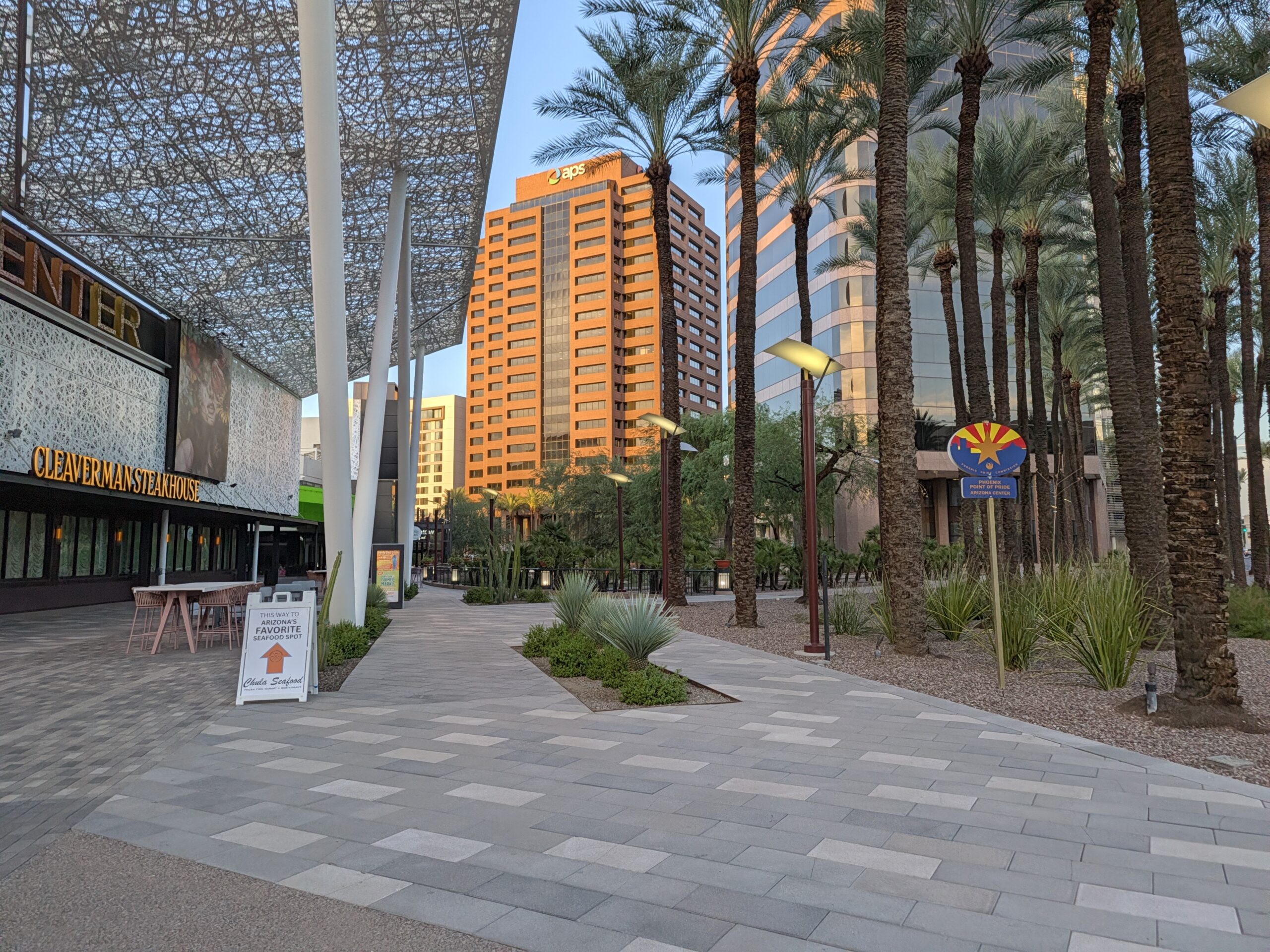 An outdoor mall plaza at sunset as captured by the Pixel 11 camera.