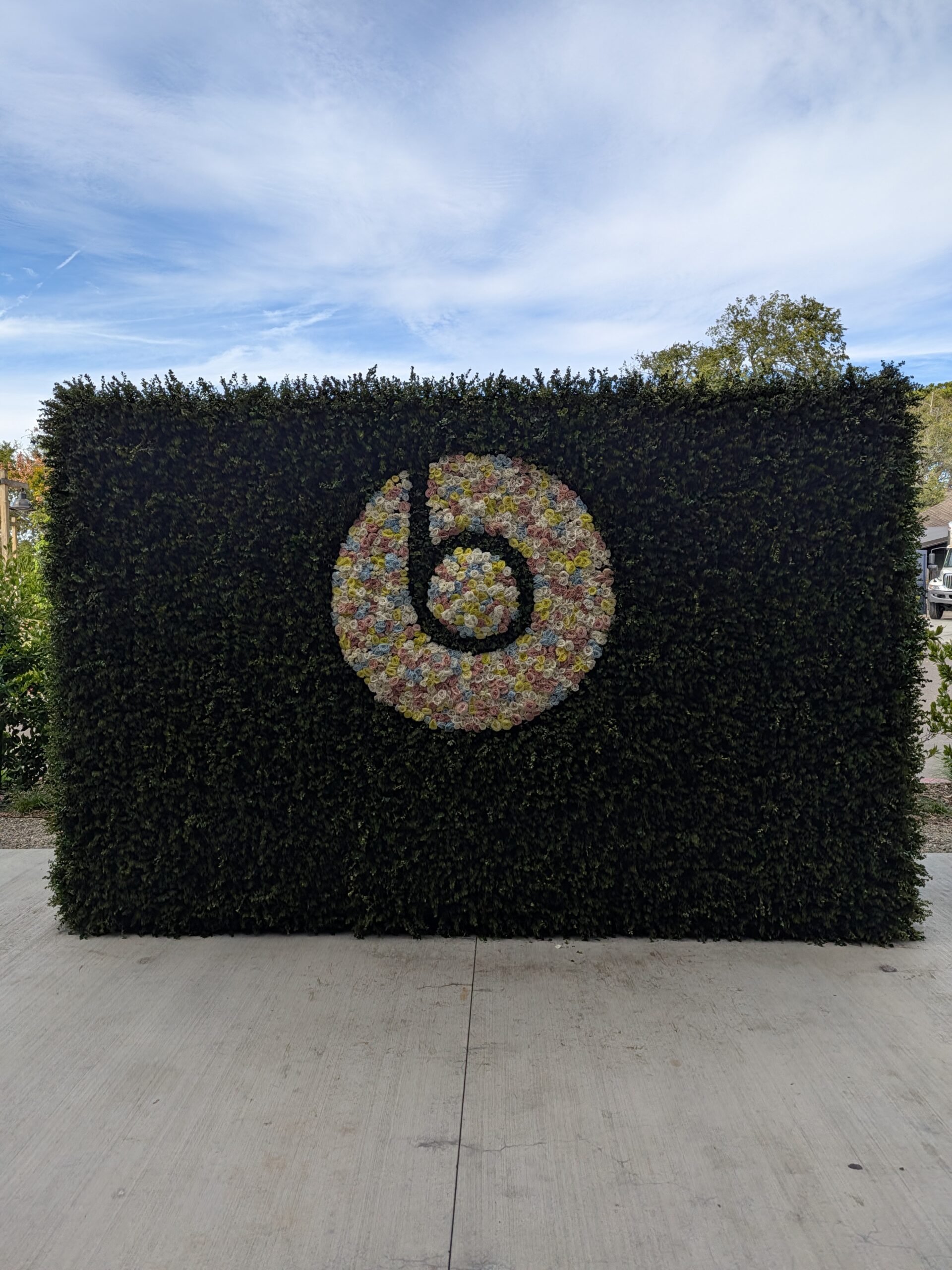 The Beats logo in a flower arrangement as captured by the Google Pixel 11 camera.