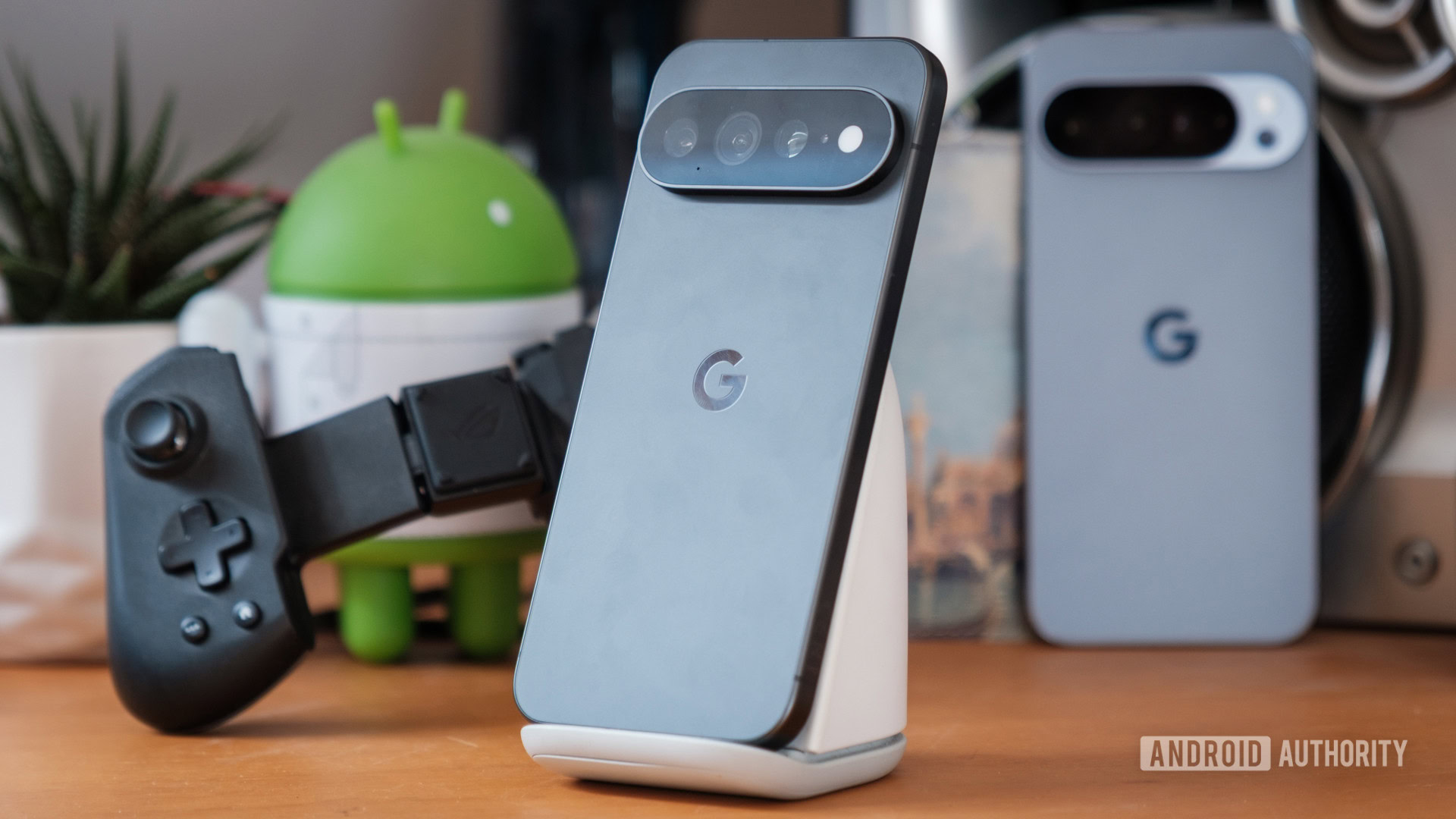 Pixel 11 Pro XL with game controller in background Pixel 11 Pro XL with game controller in background