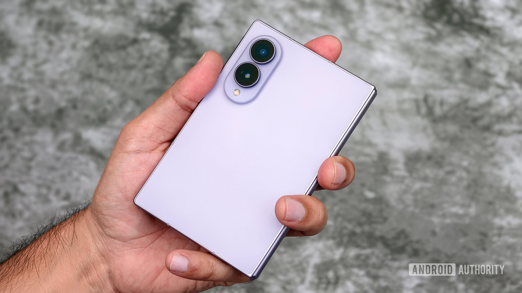 Samsung Galaxy Z Fold folded in hand Samsung Galaxy Z Fold folded in hand
