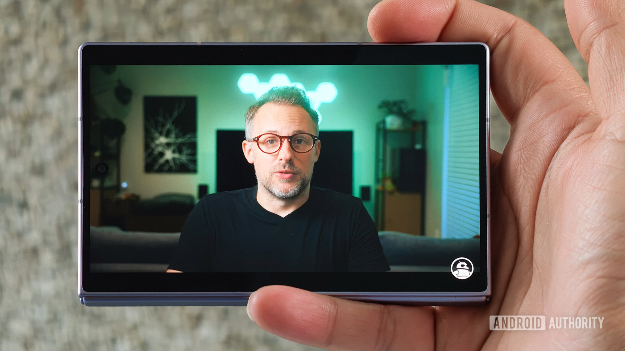 Samsung Galaxy Z Fold in hand video playing on cover screen Samsung Galaxy Z Fold in hand video playing on cover screen