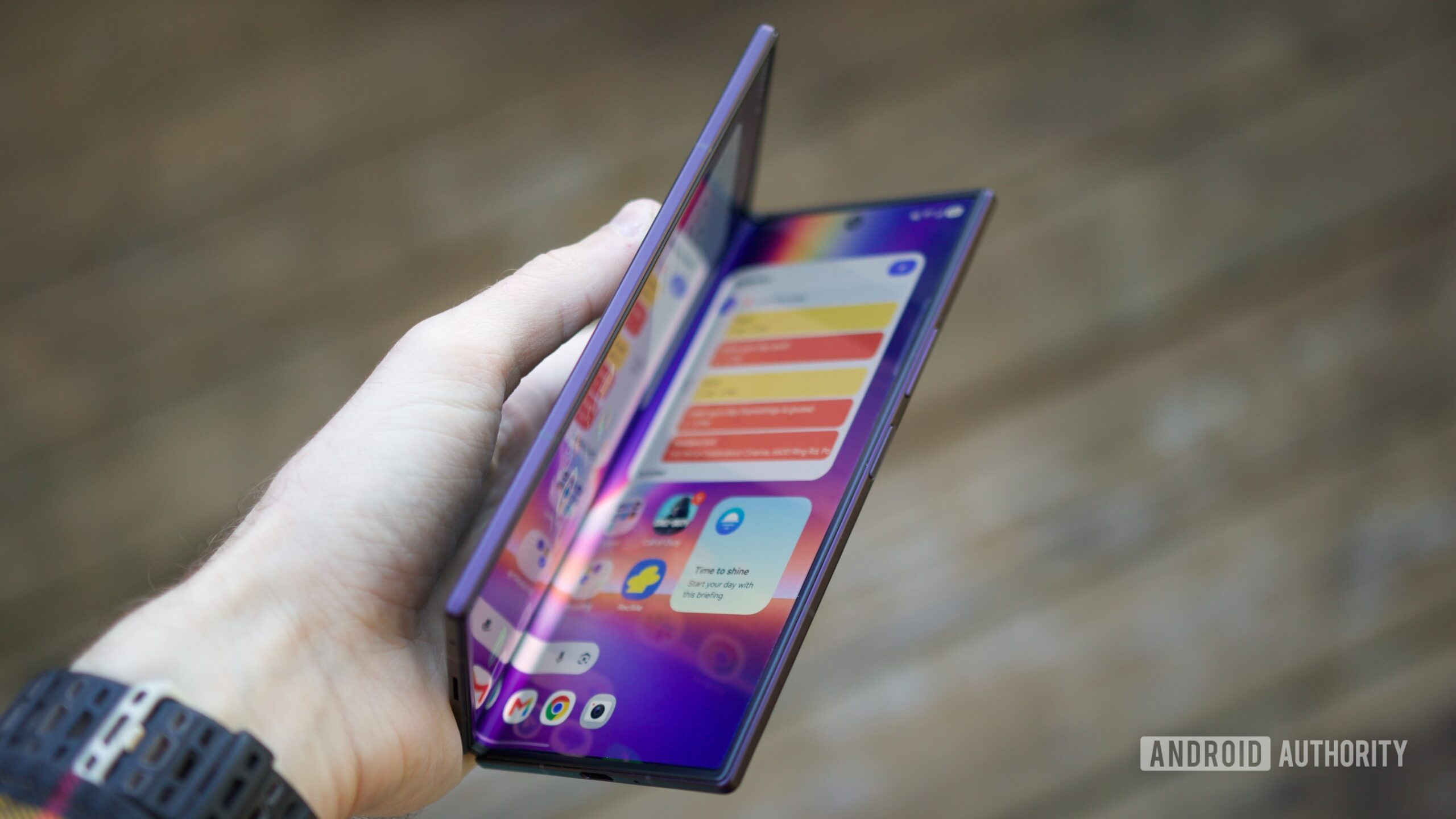 Holding a half-open Galaxy Z Fold 8 Ultra.