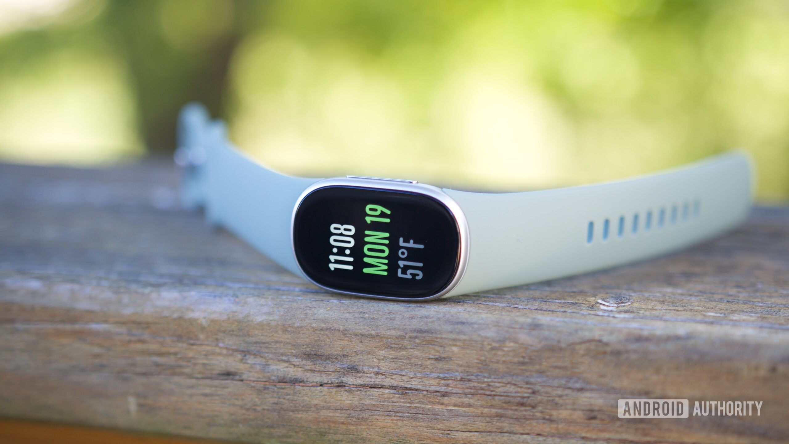 Fitbit Edge laying outside.