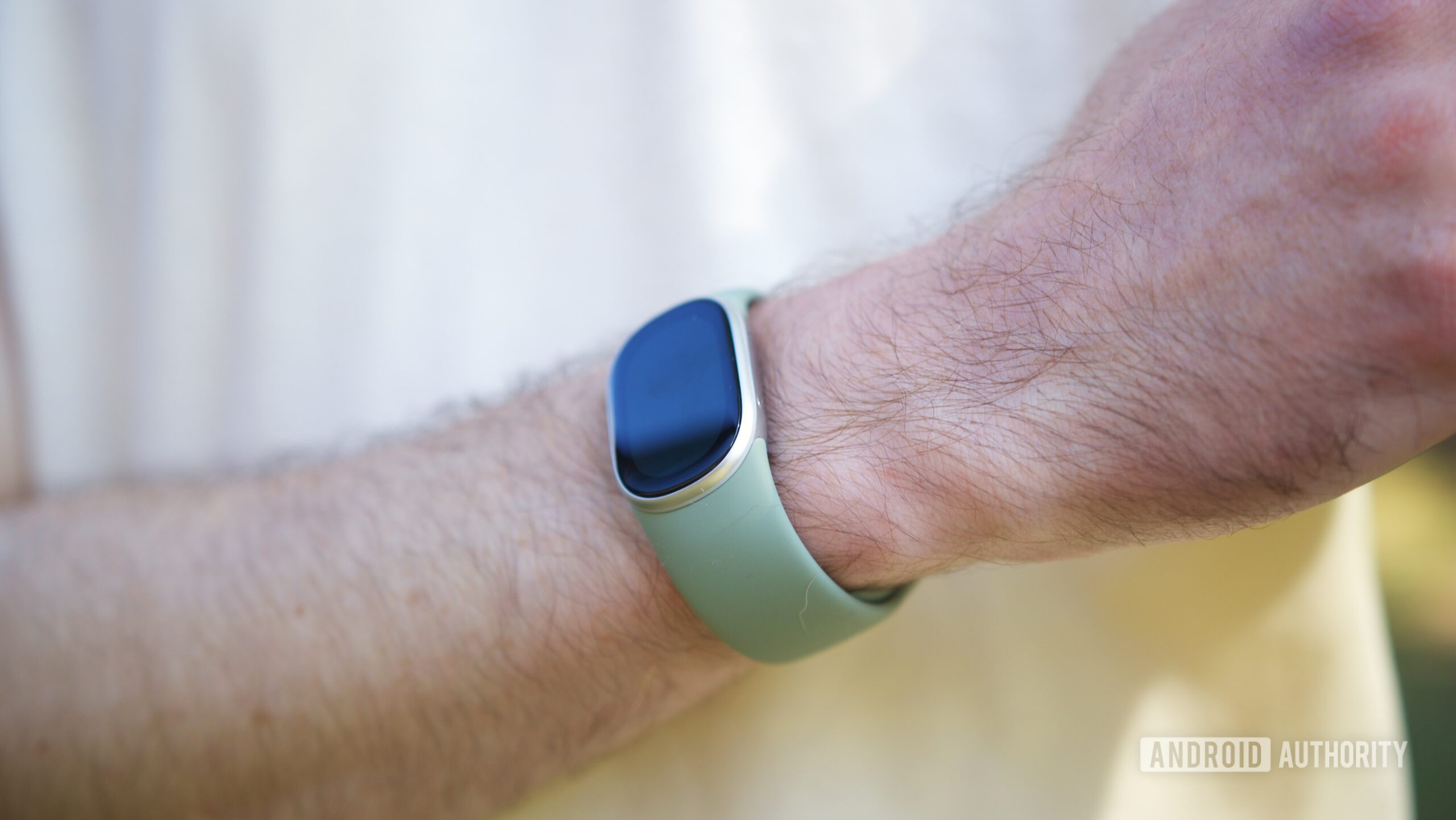 fitbit edge review hero photo 3 Someone wearing the Fitbit Edge.