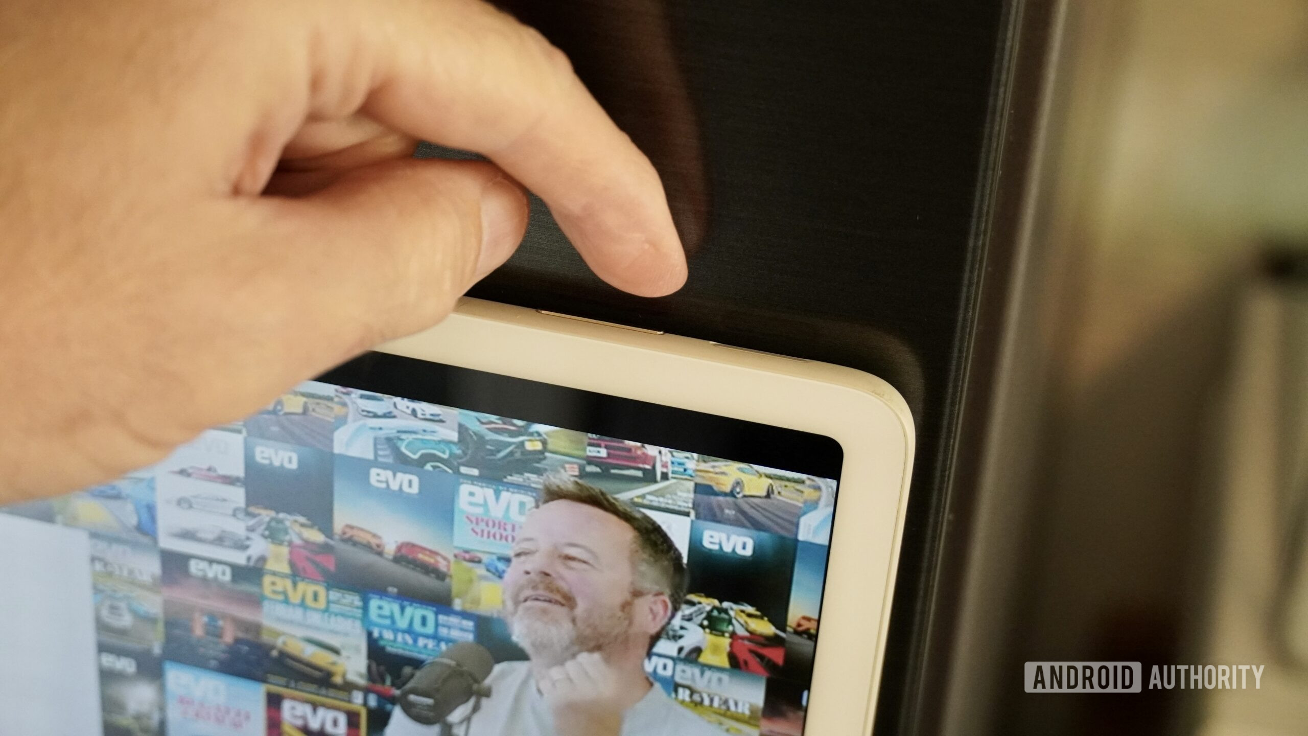 google pixel tablet volume A person changing the volume on the Google Pixel Tablet