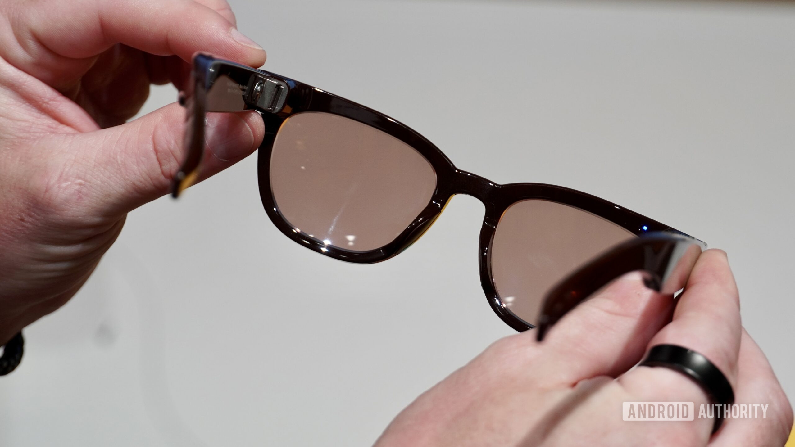 samsung warby parker hand A person holding the Samsung Warby Parker smart glasses